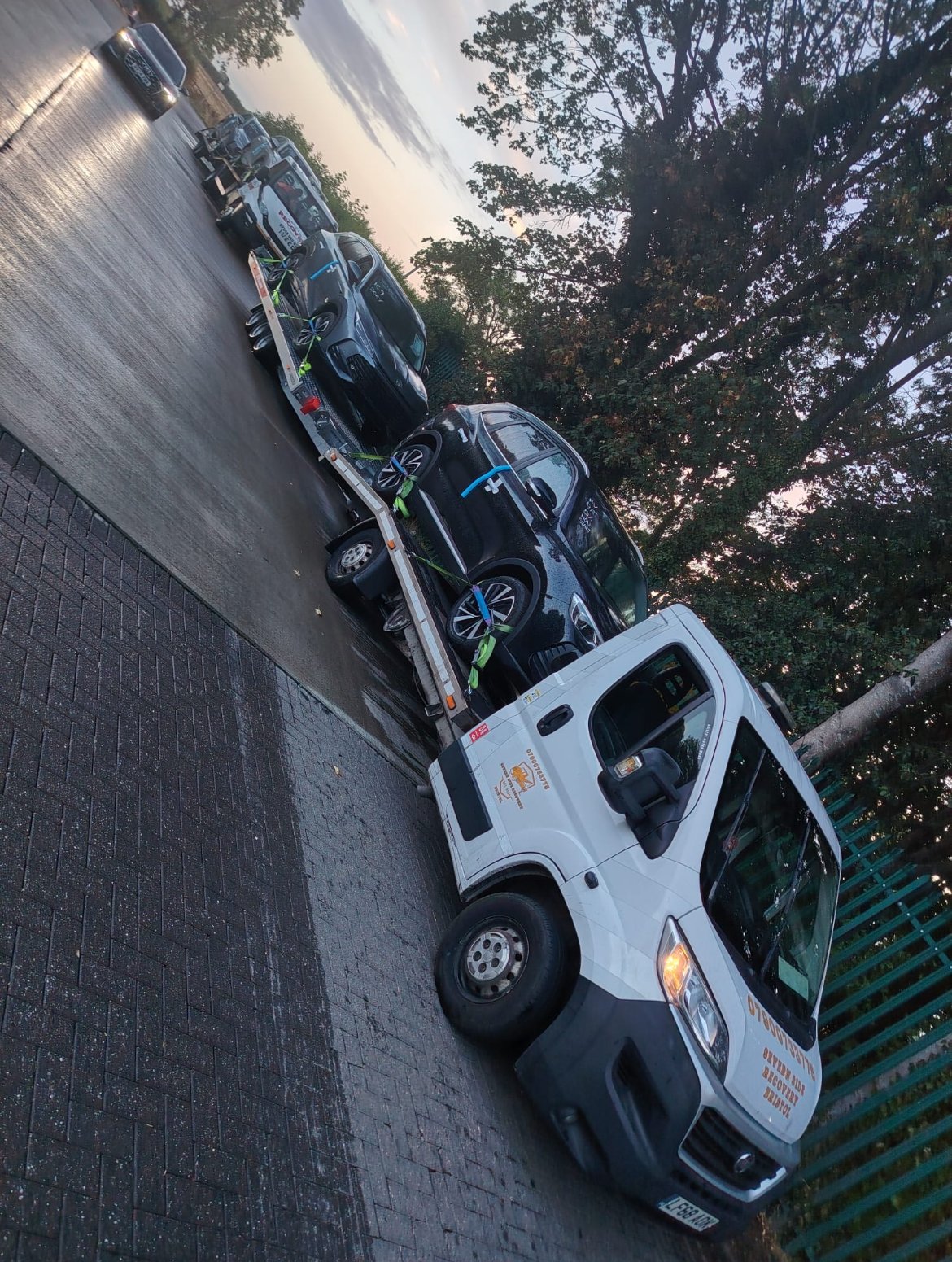 Our truck and trailer carrying two cars