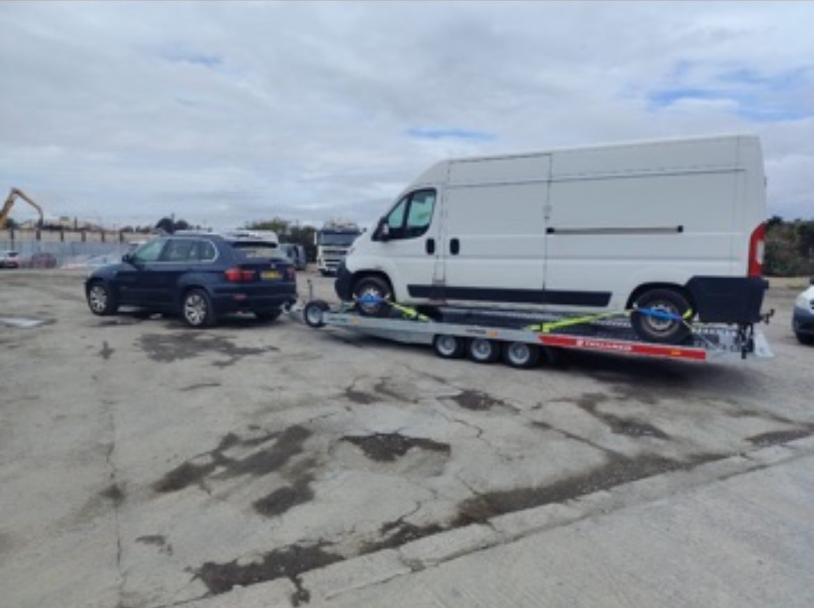 Van being transported on our trailer