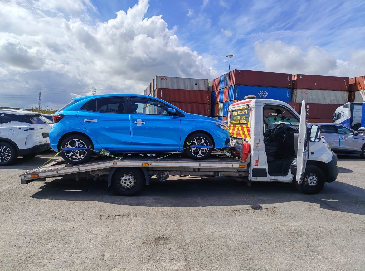 Blue hatchback loaded on a Severn Side Recovery truck
